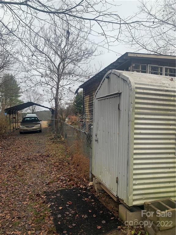 1390 Cove Road Rutherfordton, NC 28139 - Photo 5 of 15 a side view of a house with a yard