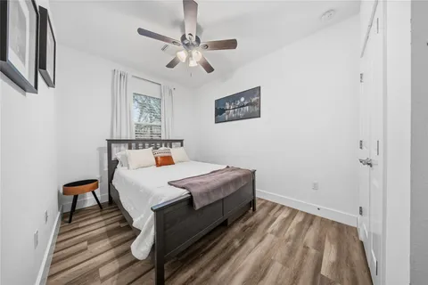 a bedroom with a bed and a table