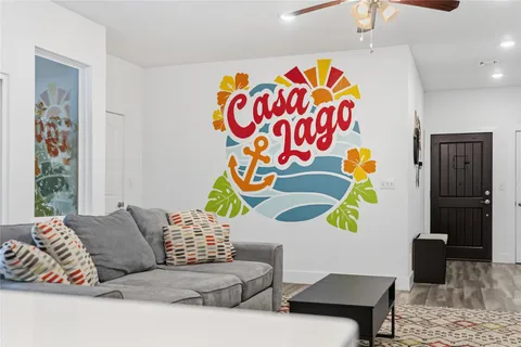 a living room with a couch and a potted plant