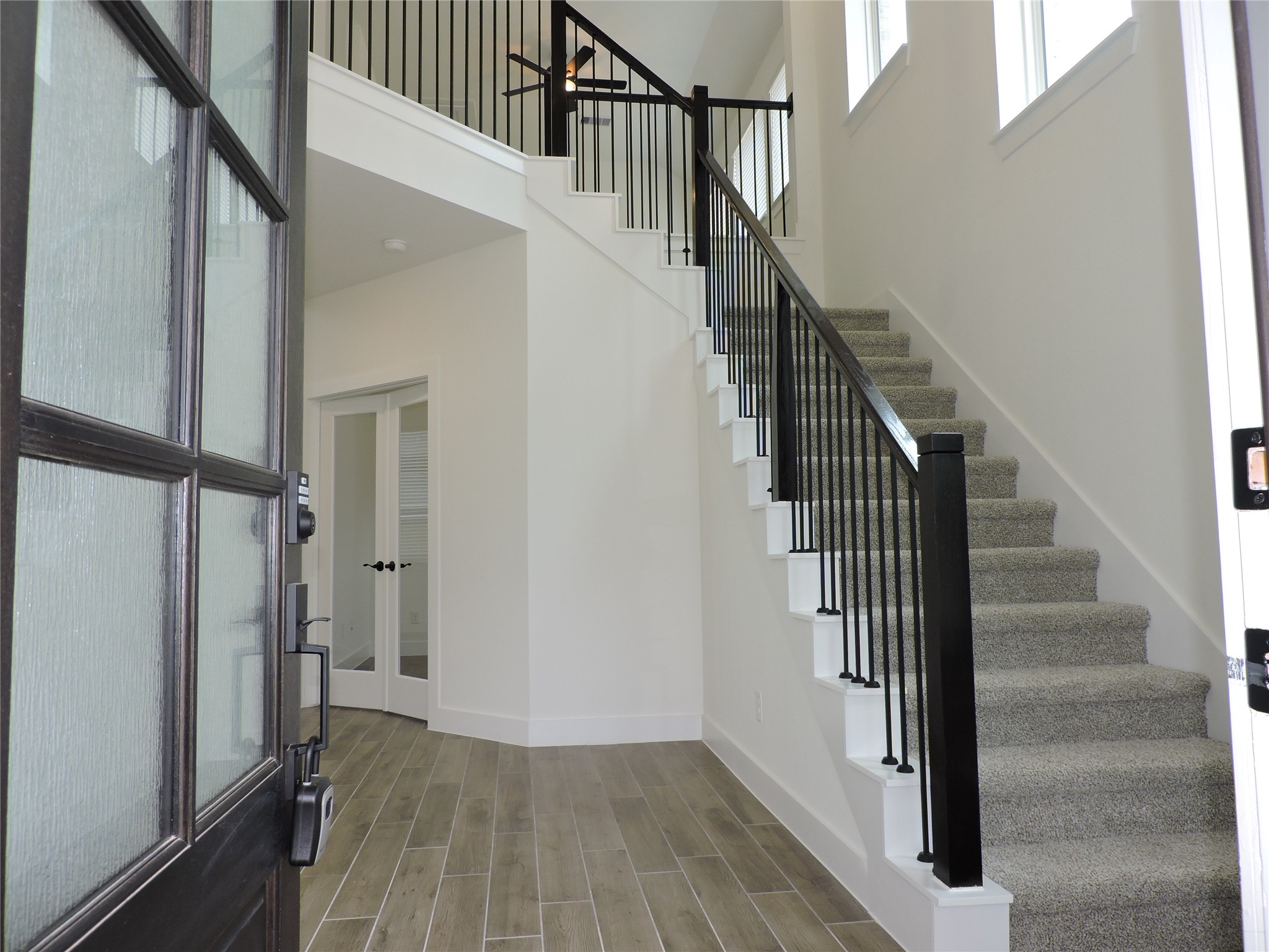 12853 Meadow Wind Way Conroe, TX 77302 - Photo 5 of 47 Your Family and Guest will be wowed upon Entry. Large open Foyer with High Ceilings and beautiful staircase.