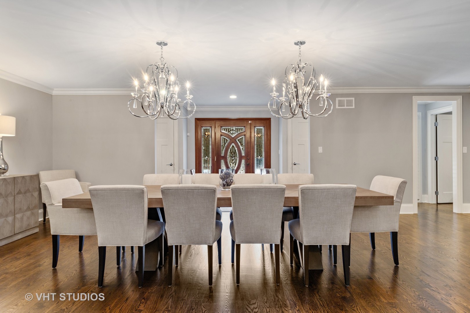 2801 Meyers Road Oak Brook, IL 60523 - Photo 19 of 48 a view of a dining room with furniture a chandelier and wooden floor