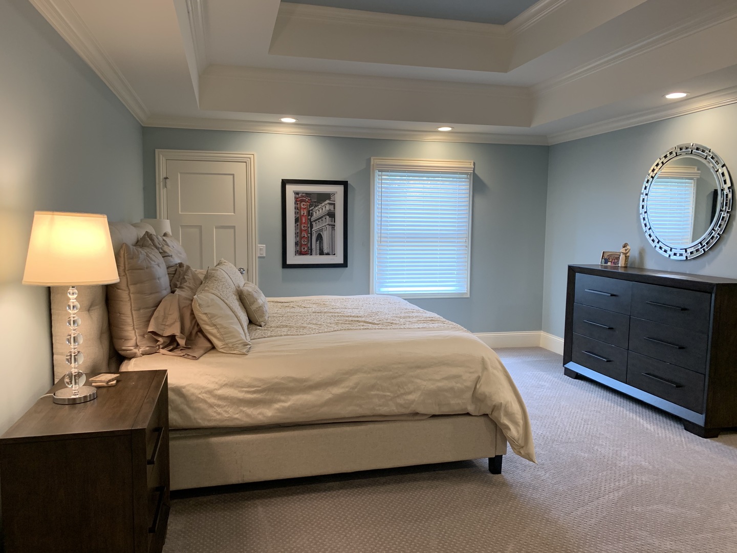 2801 Meyers Road Oak Brook, IL 60523 - Photo 31 of 48 a spacious bedroom with a bed and a lamp on table