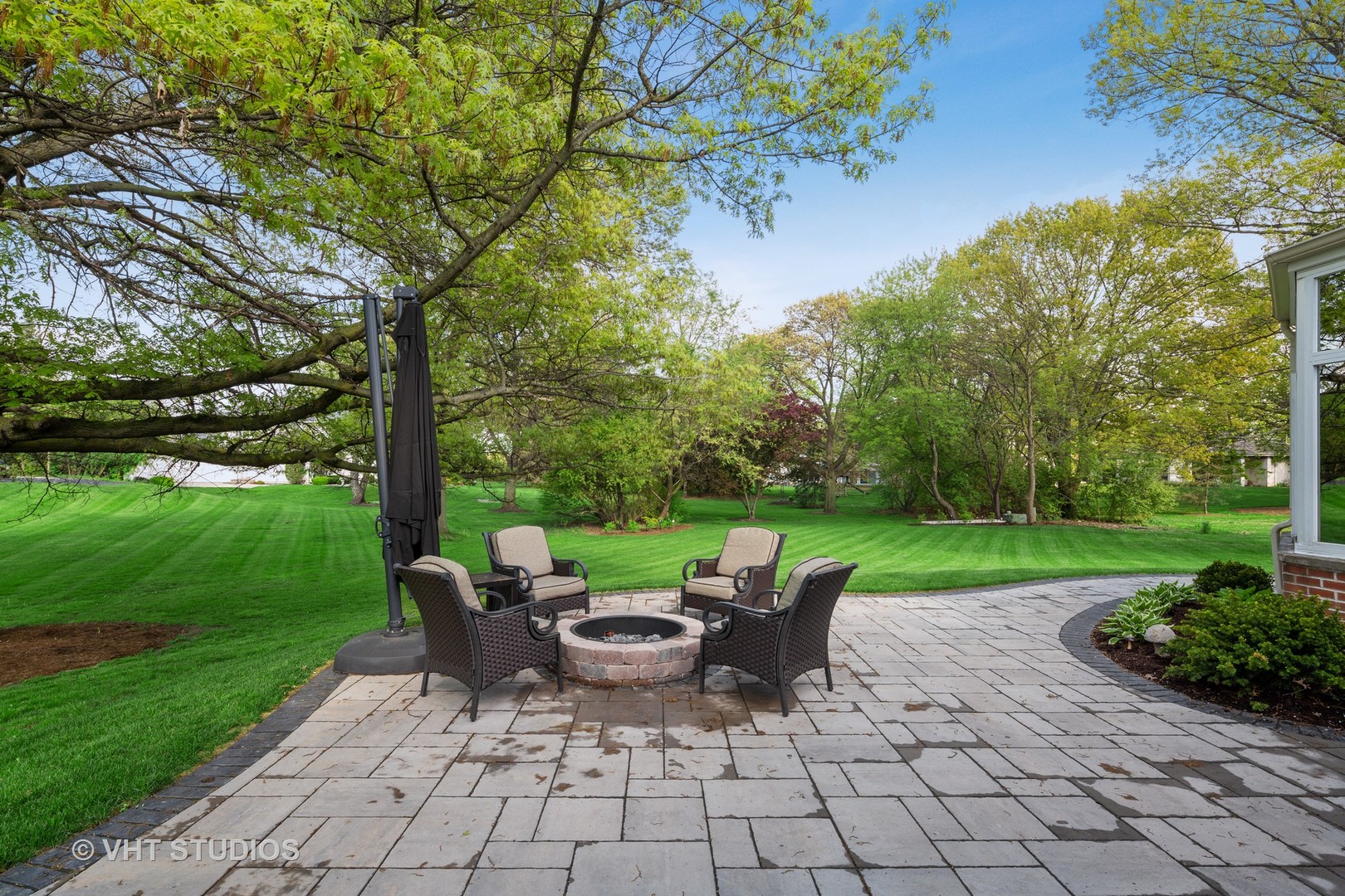 2801 Meyers Road Oak Brook, IL 60523 - Photo 40 of 48 a view of a patio with table and chairs potted plants and large tree