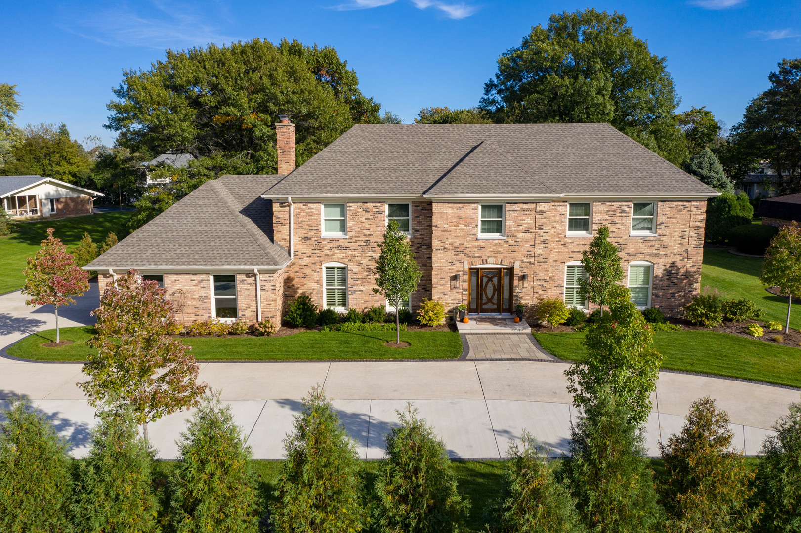 2801 Meyers Road Oak Brook, IL 60523 - Photo 45 of 48 a view of house with garden and tall tress