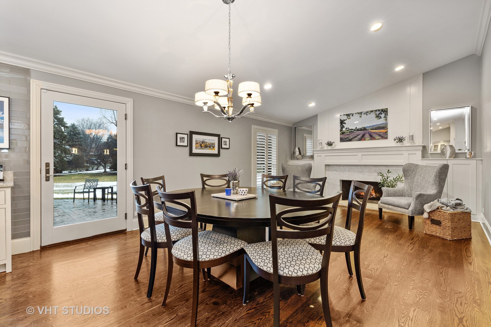 2801 Meyers Road Oak Brook, IL 60523 - Photo 6 of 48 a view of a dining room with furniture wooden floor and a chandelier