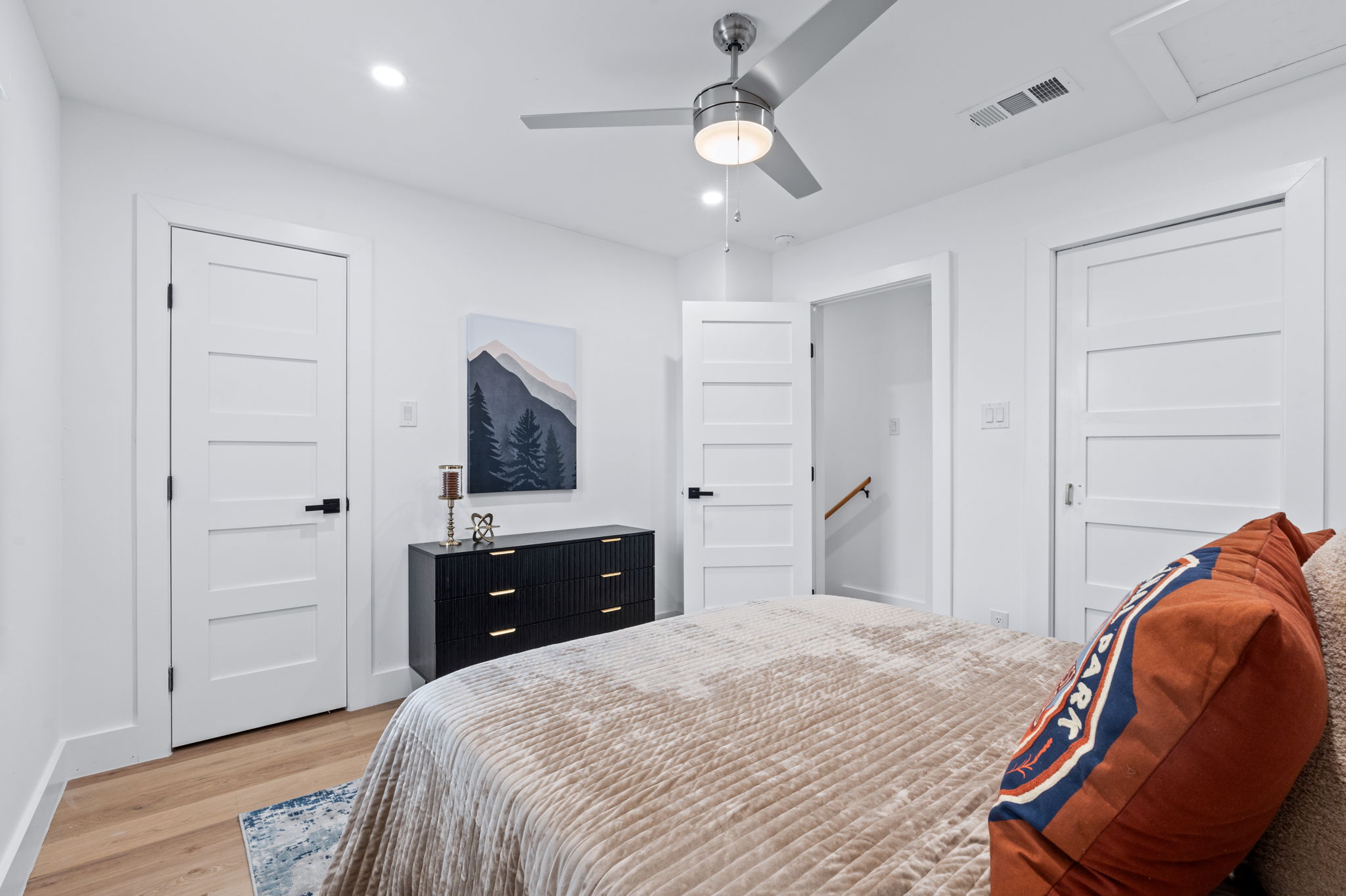 2706 Wheless Lane, Unit 101 Austin, TX 78723 - Photo 15 of 24 a bedroom with a bed and a chair