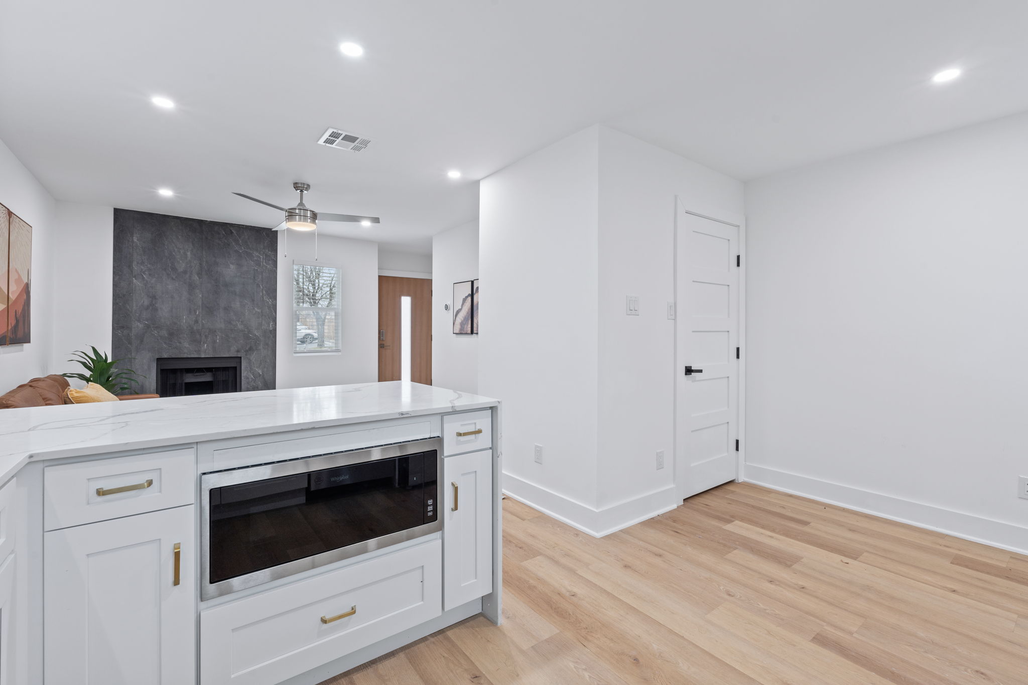 2706 Wheless Lane, Unit 101 Austin, TX 78723 - Photo 10 of 24 a kitchen with a stove and white cabinets