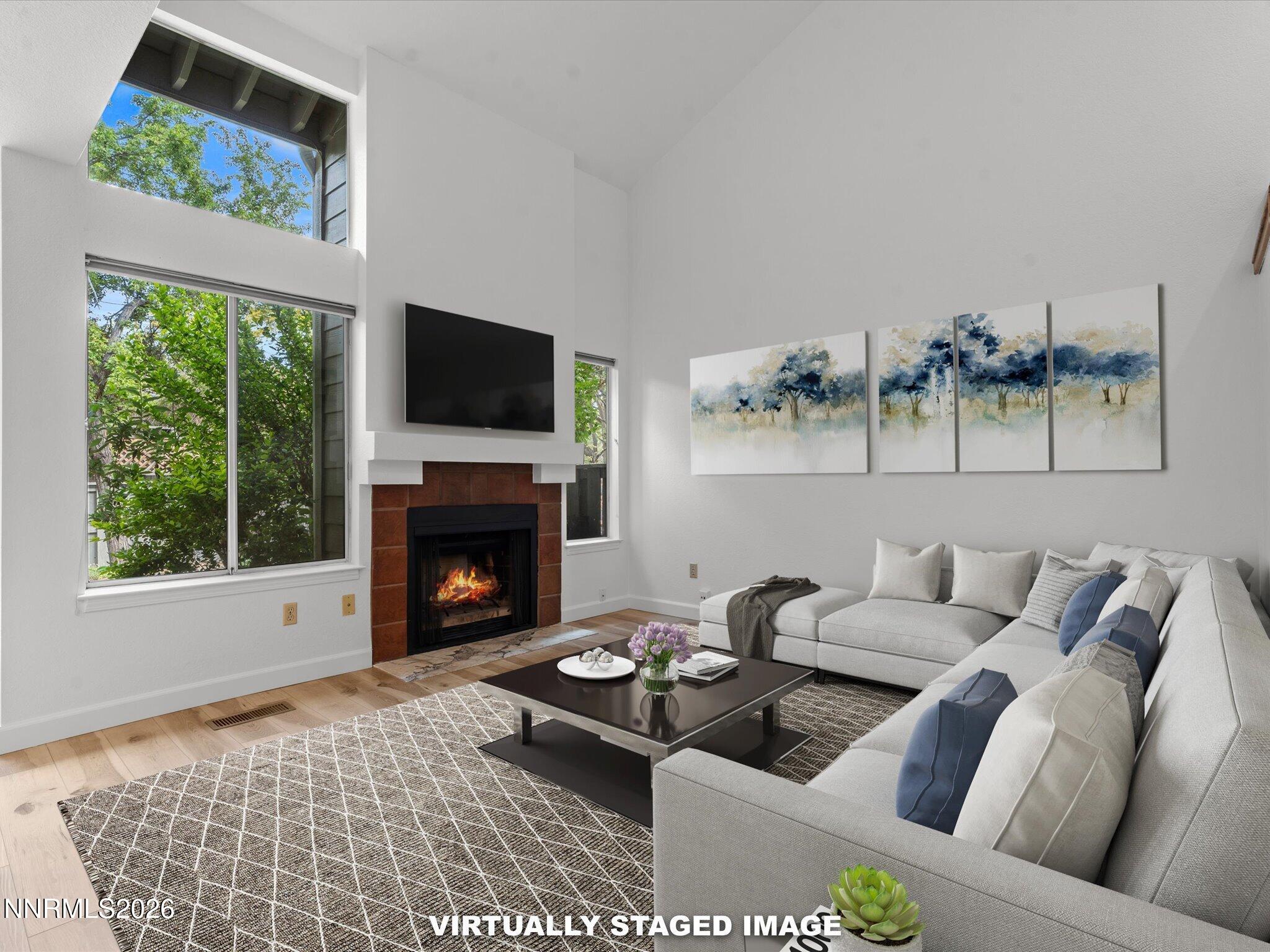 3170 Oakshire Court Reno, NV 89509 - Photo 7 of 43 a living room with furniture and a fireplace
