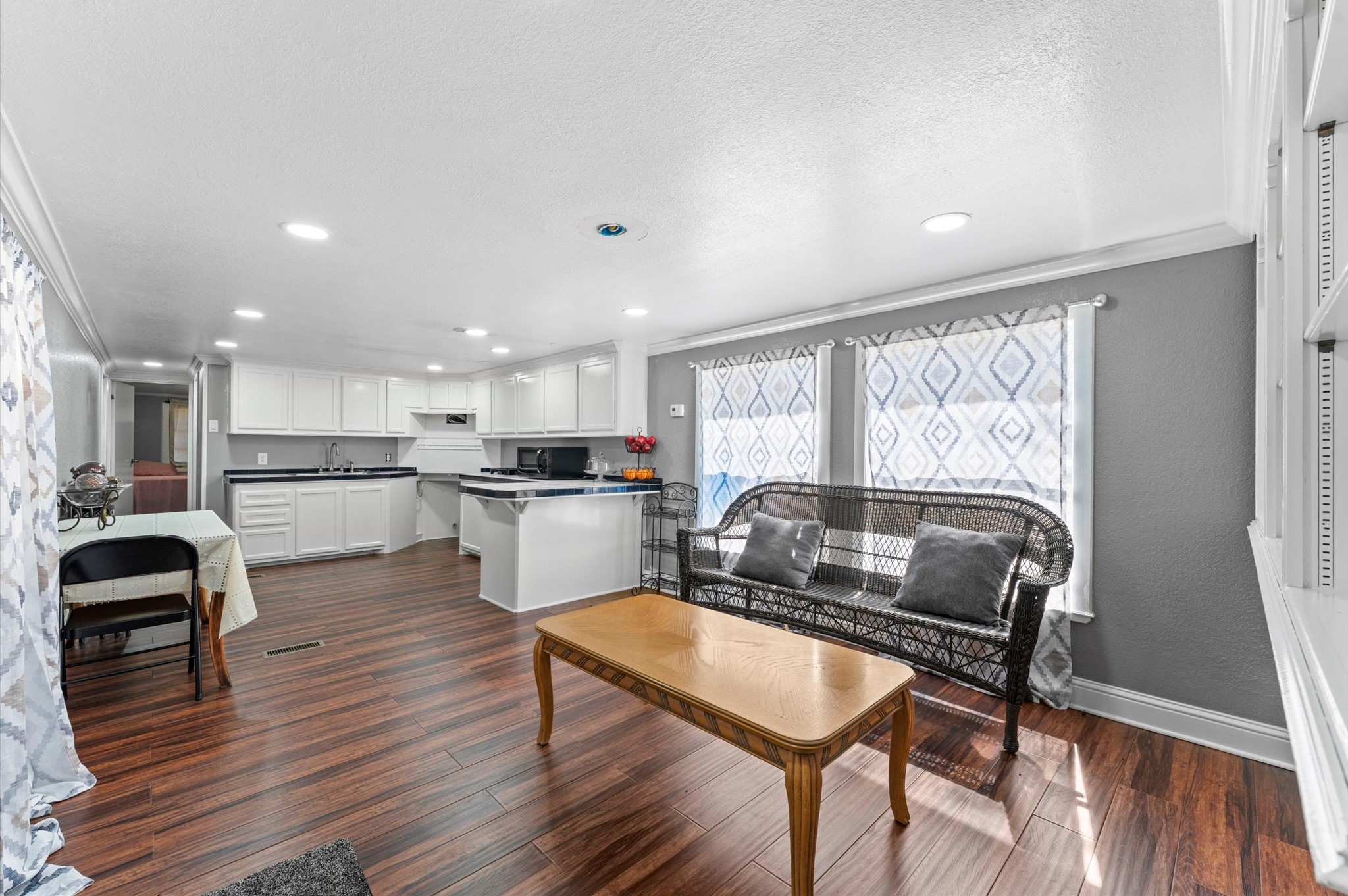 2504 Oak Ridge Road Willis, TX 77378 - Photo 7 of 10 a living room with furniture and kitchen view