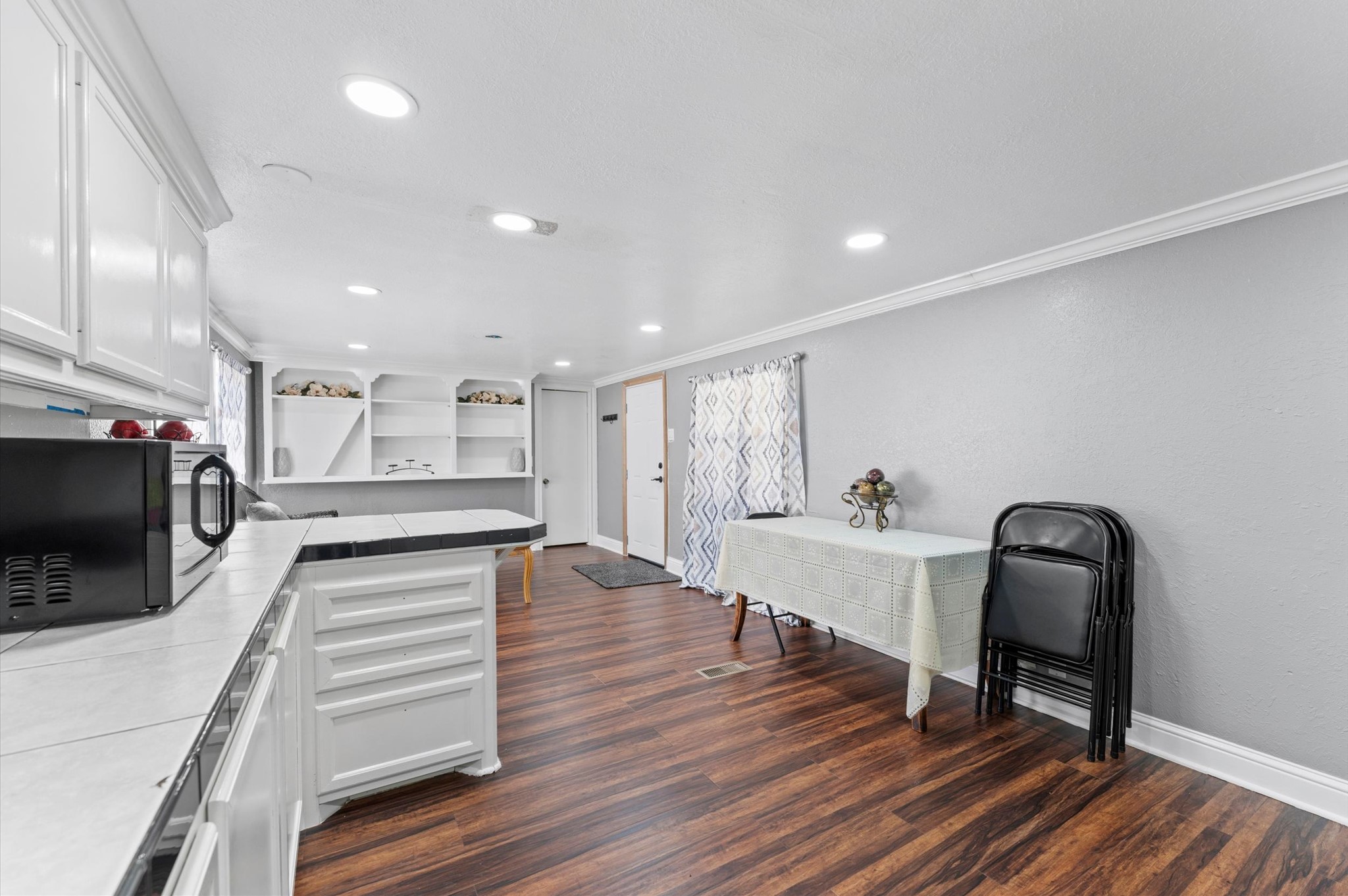 2504 Oak Ridge Road Willis, TX 77378 - Photo 10 of 10 a view of a kitchen with workspace and wooden floor