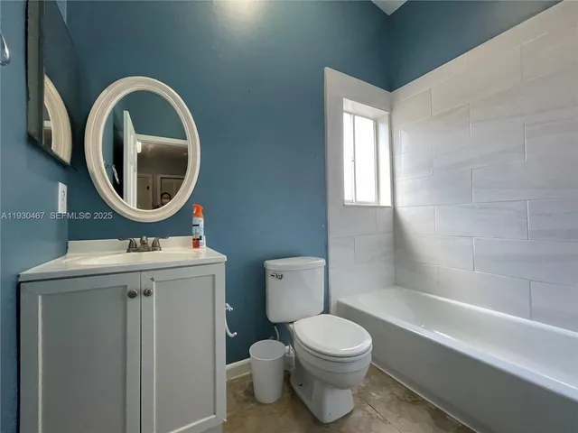 a view of a back yard of the house with a small yard