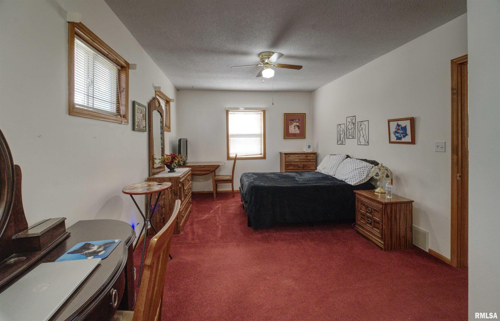 500 4th Avenue North Clinton, IA 52732 - Photo 11 of 18 a living room with furniture a piano and a window