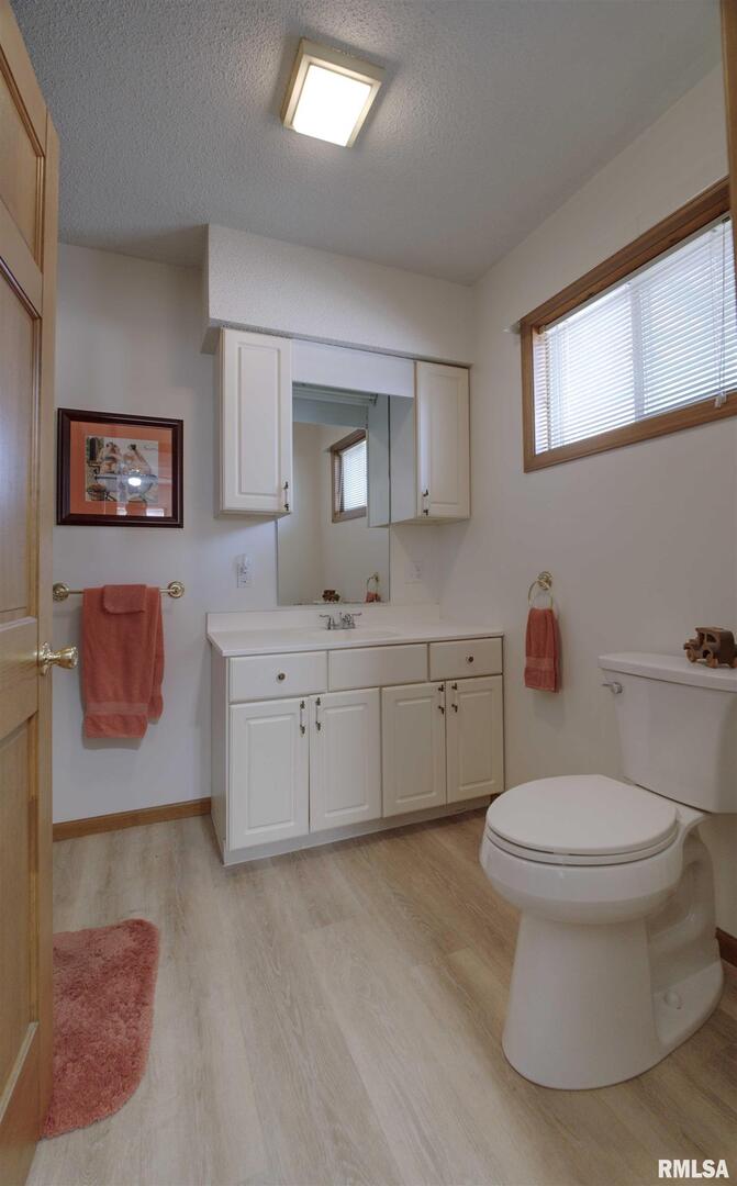500 4th Avenue North Clinton, IA 52732 - Photo 14 of 18 a bathroom with a toilet sink and mirror