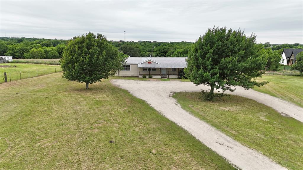 9721 Limestone Joshua, TX 76058 - Photo 36 of 36 a view of a yard with an outdoor space