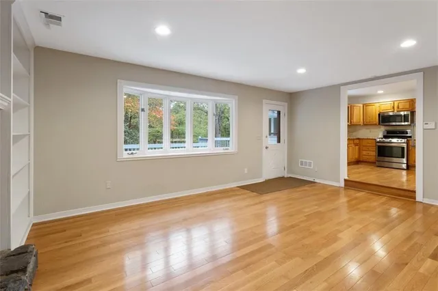 a kitchen with stainless steel appliances granite countertop a refrigerator and a sink