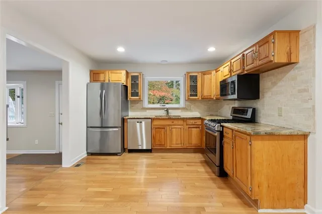 a view of a room with wooden floor and staircase