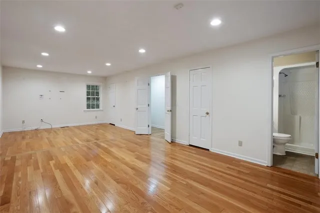 a view of an empty room with a window