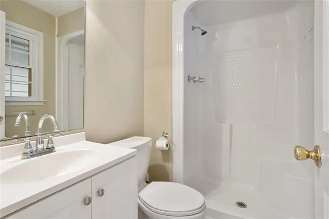 a view of a livingroom with furniture and staircase
