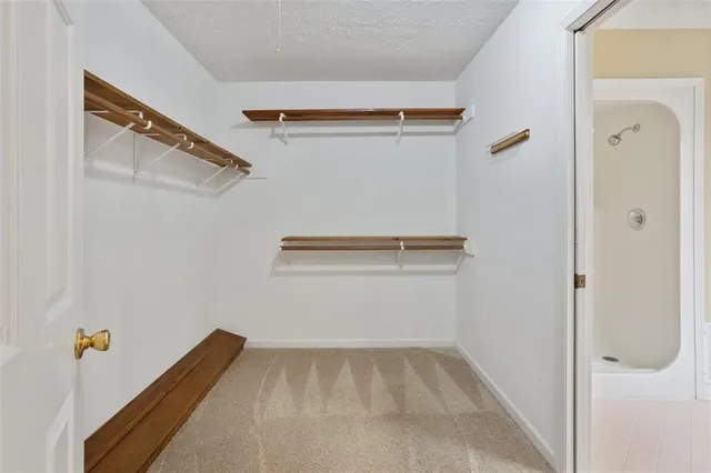 a view of a livingroom with furniture and a flat screen tv