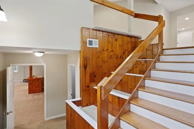 a front view of a house with yard and glass top table