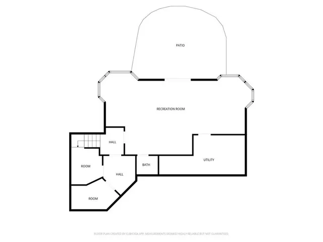 a view of an empty room with window and fire place