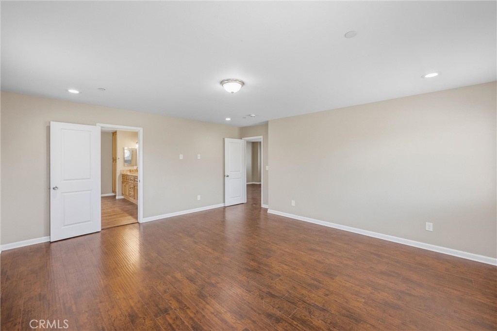 956 West Tibbot Street Rialto, CA 92377 - Photo 26 of 37 a view of an empty room with wooden floor and closet
