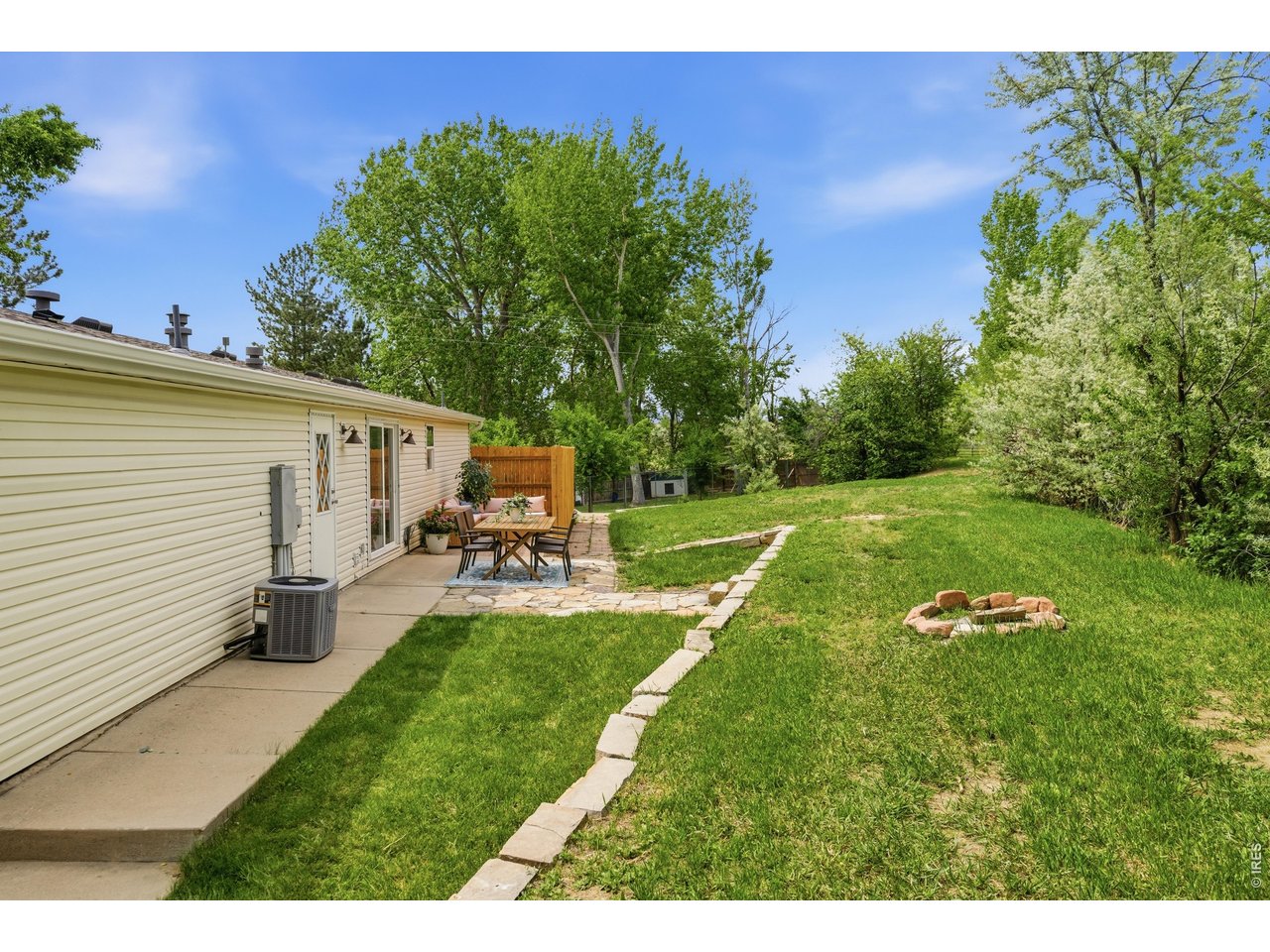 108 East Douglas Road Fort Collins, CO 80524 - Photo 31 of 38 Backyard abuts a canal