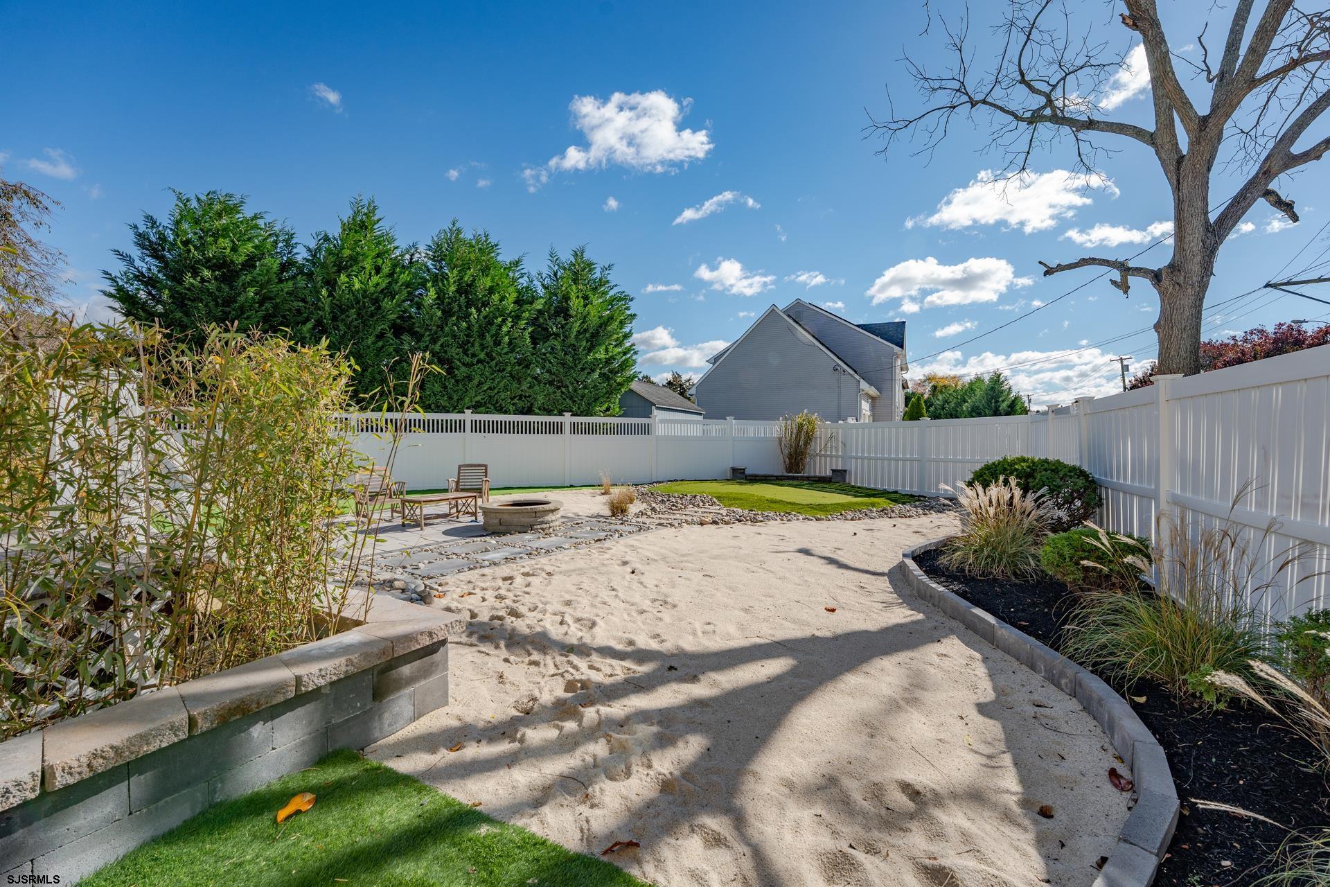 1203 West Mill Road Northfield, NJ 08225 - Photo 43 of 90 a view of a backyard of the house
