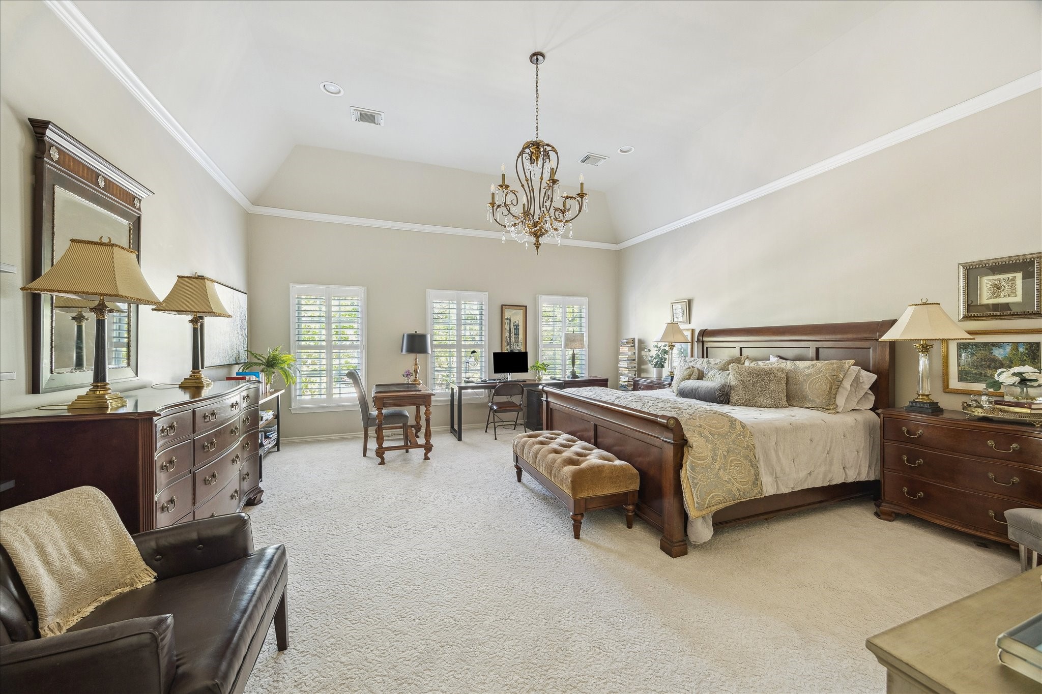 2435 North Boulevard Houston, TX 77098 - Photo 14 of 25 a spacious bedroom with furniture and a chandelier