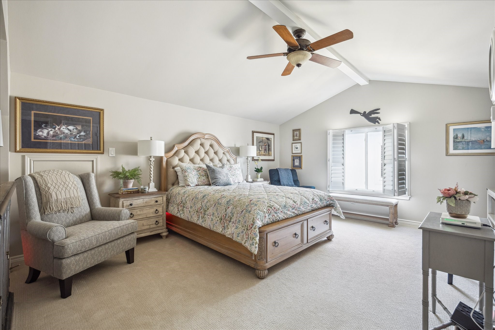 2435 North Boulevard Houston, TX 77098 - Photo 18 of 25 a bedroom with a bed a couch and a chandelier