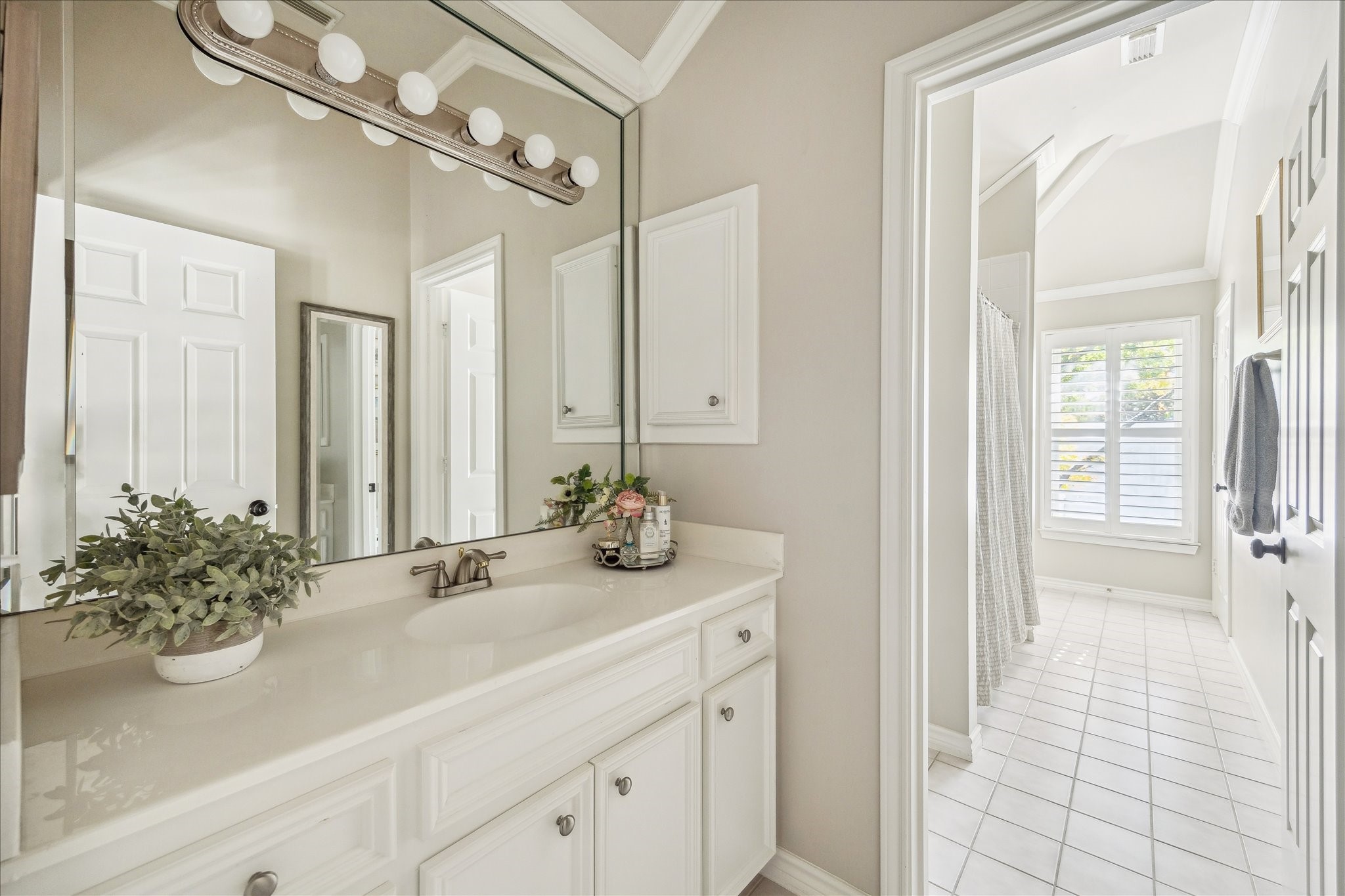 2435 North Boulevard Houston, TX 77098 - Photo 20 of 25 a bathroom with a sink a large mirror and a shower