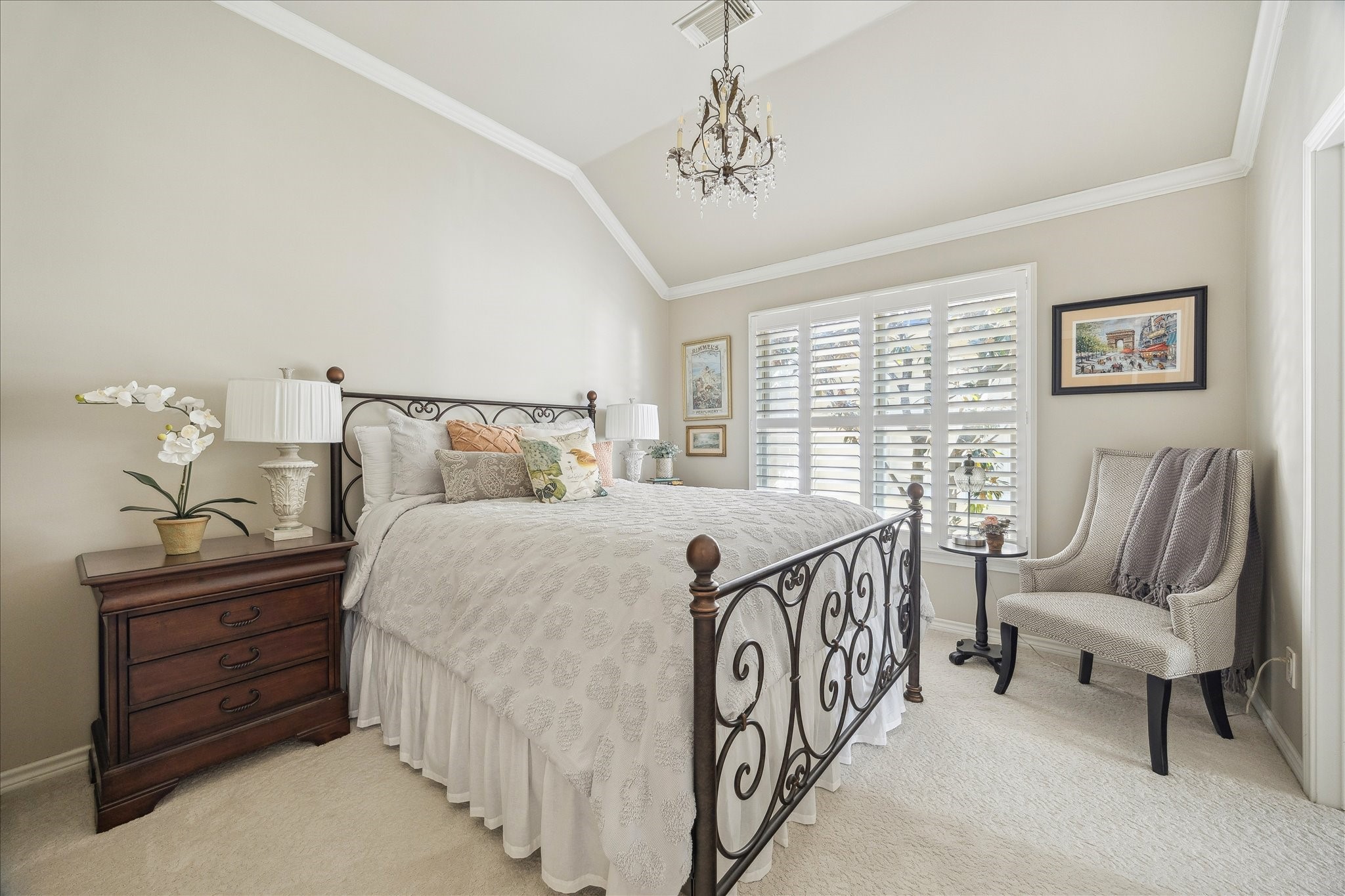 2435 North Boulevard Houston, TX 77098 - Photo 21 of 25 a bedroom with a bed and a chandelier