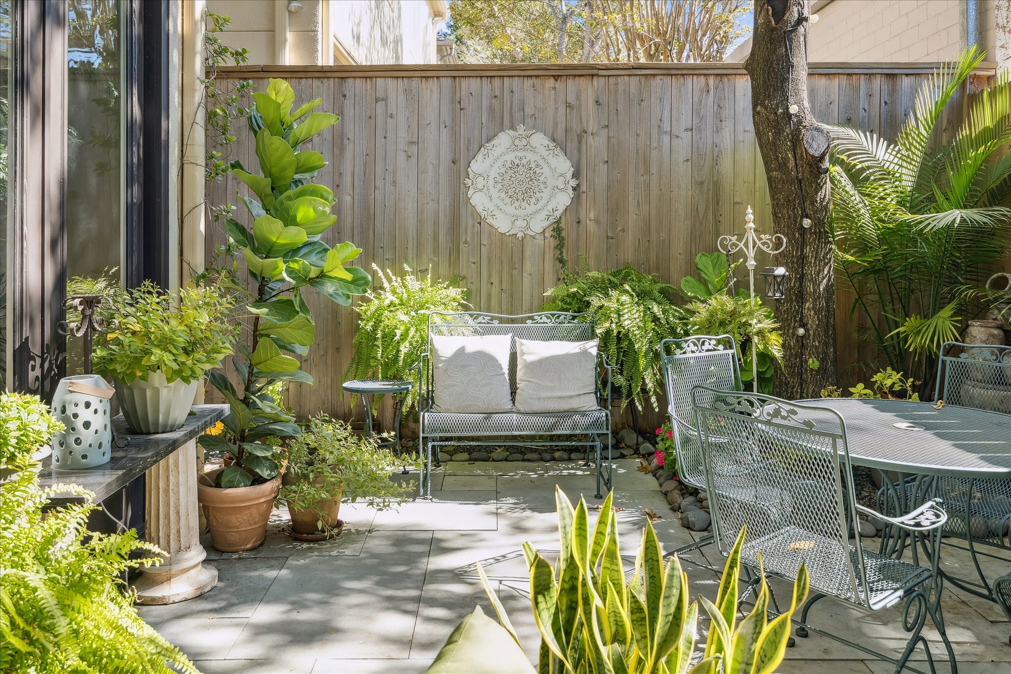 2435 North Boulevard Houston, TX 77098 - Photo 24 of 25 a potted plant sitting in front of a house