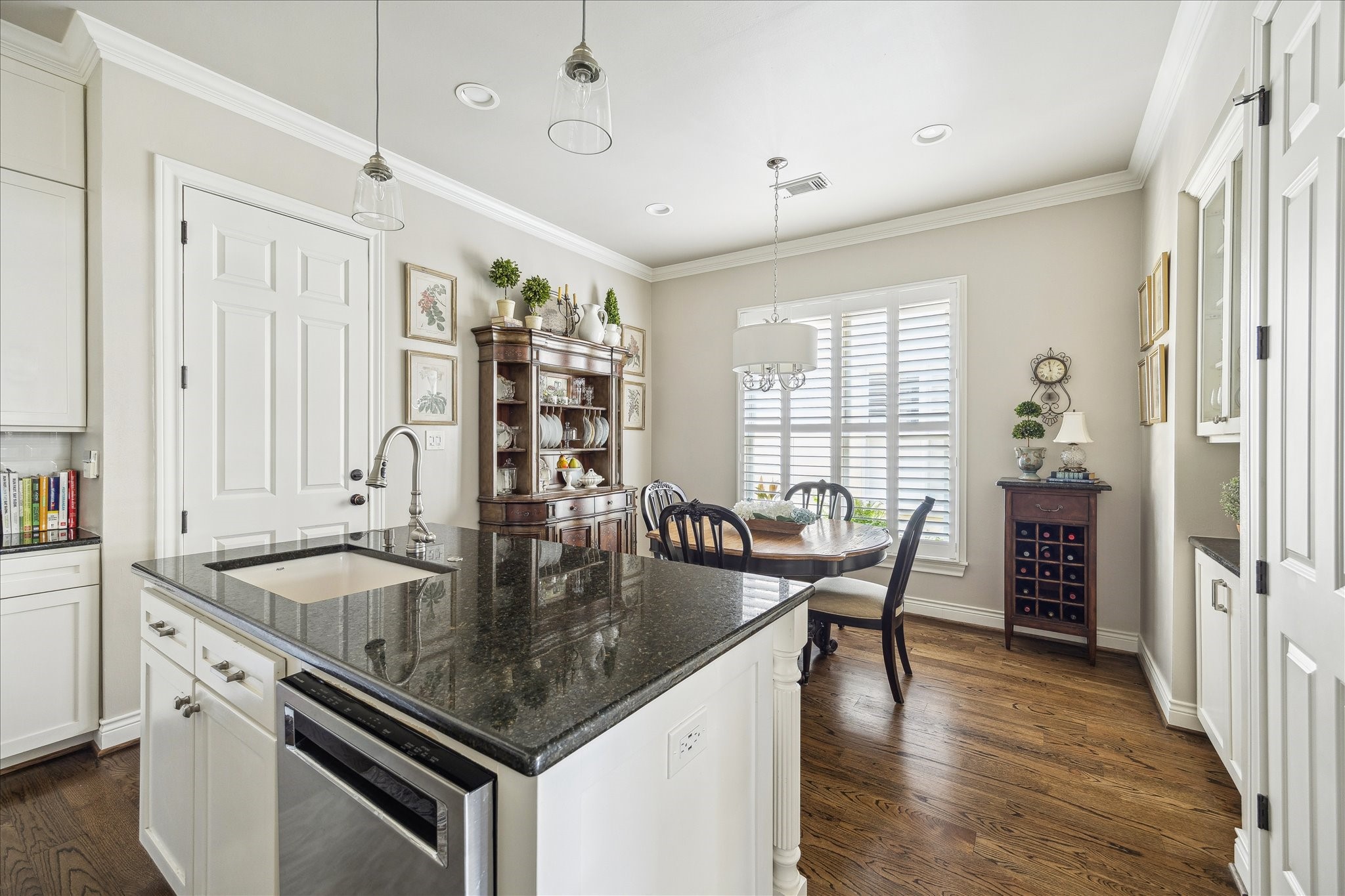 2435 North Boulevard Houston, TX 77098 - Photo 10 of 25 a kitchen with stainless steel appliances granite countertop a stove and a center island with wooden floor