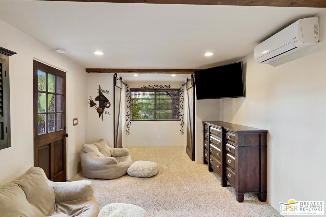 15911 Falls Creek Road Whitewater, CA 92282 - Photo 15 of 61 a living room with furniture and a flat screen tv