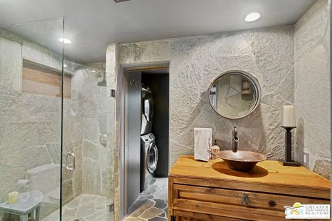 a kitchen with stainless steel appliances granite countertop a stove and refrigerator