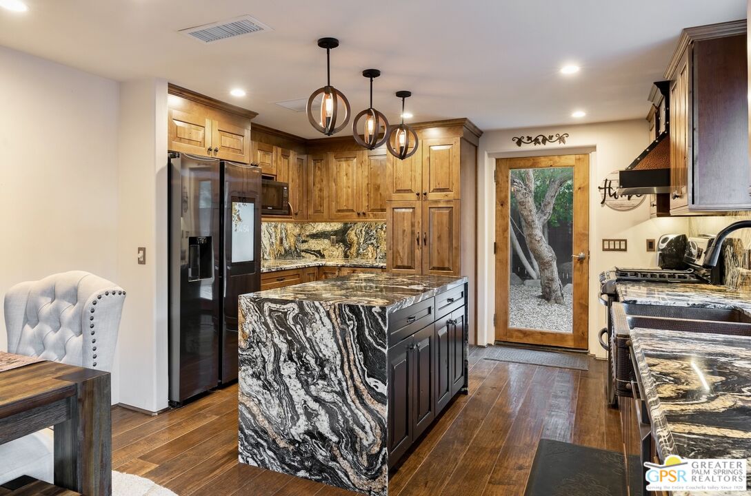 15911 Falls Creek Road Whitewater, CA 92282 - Photo 21 of 61 a kitchen with stainless steel appliances granite countertop a stove and refrigerator