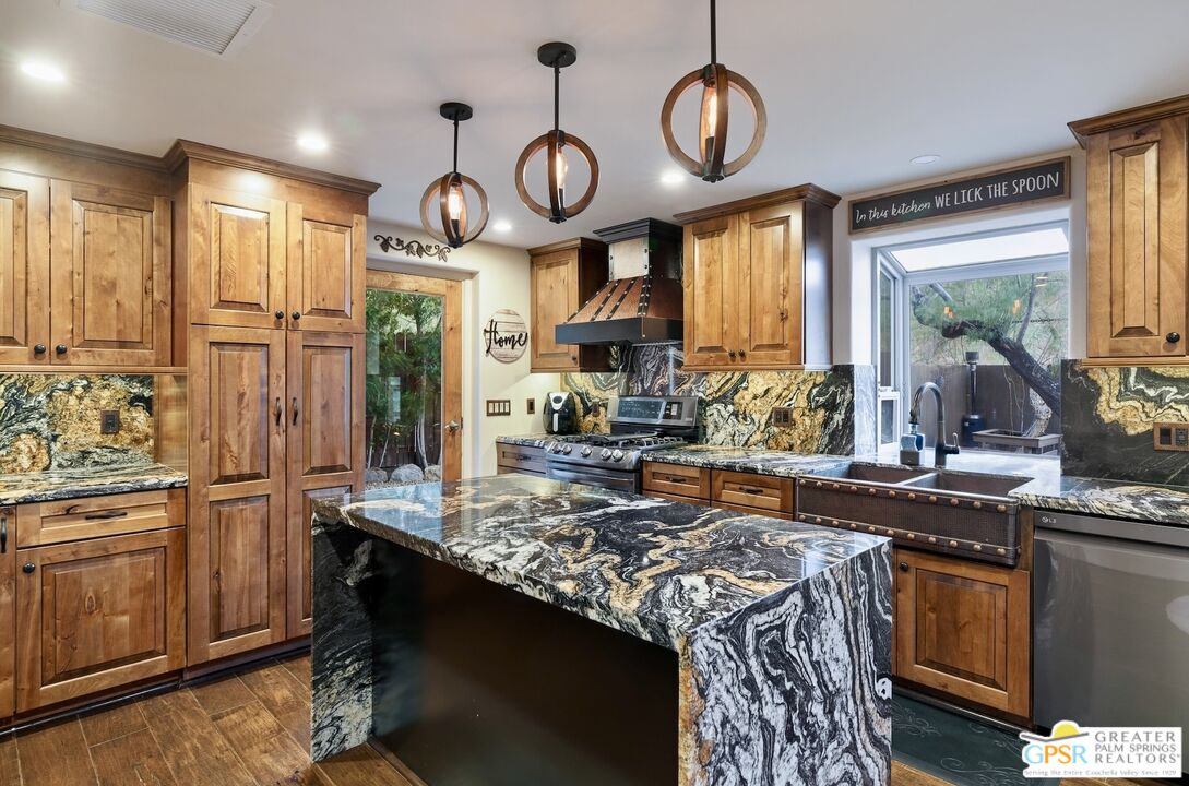 15911 Falls Creek Road Whitewater, CA 92282 - Photo 24 of 61 a kitchen with stainless steel appliances granite countertop a stove a sink and a refrigerator