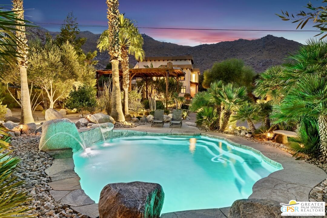 15911 Falls Creek Road Whitewater, CA 92282 - Photo 28 of 61 a view of a swimming pool with a yard and plants