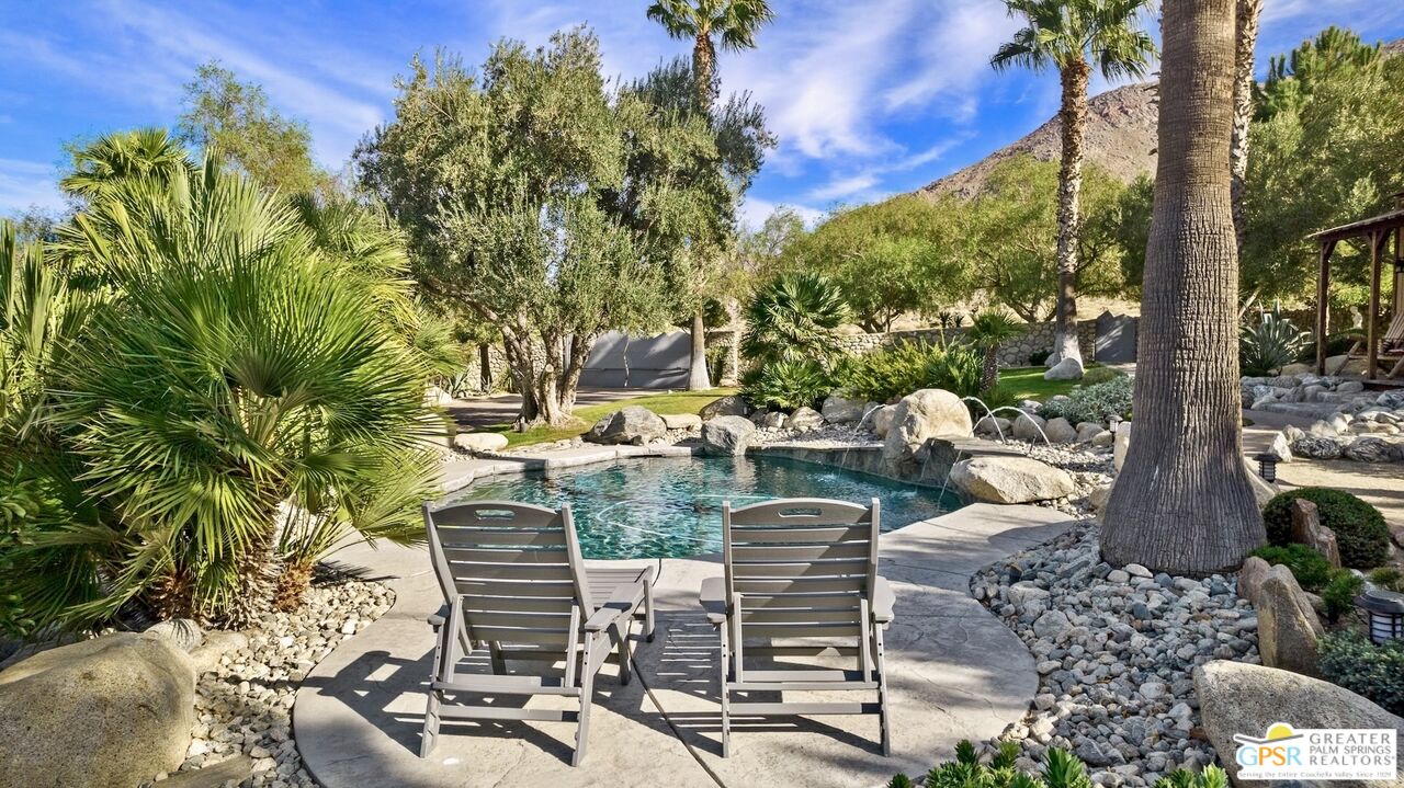 15911 Falls Creek Road Whitewater, CA 92282 - Photo 34 of 61 a view of a patio with table and chairs and potted plants