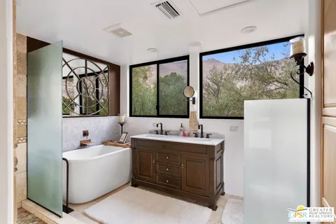 a bathroom with a bathtub and shower
