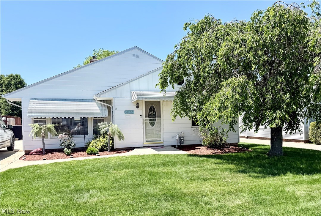 32125 Densmore Road Willowick, OH 44095 - Photo 2 of 23 White single-story residence featuring a front lawn and mature shade tree
