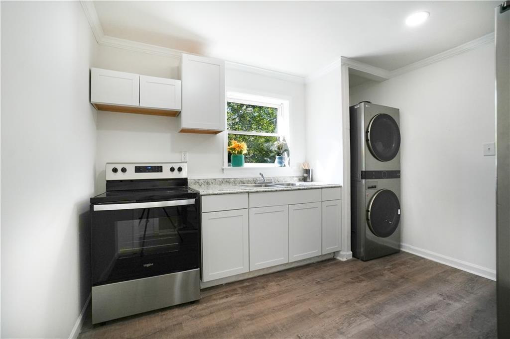 444 Fairburn Road Northwest Atlanta, GA 30331 - Photo 12 of 21 a kitchen with a sink and a stove
