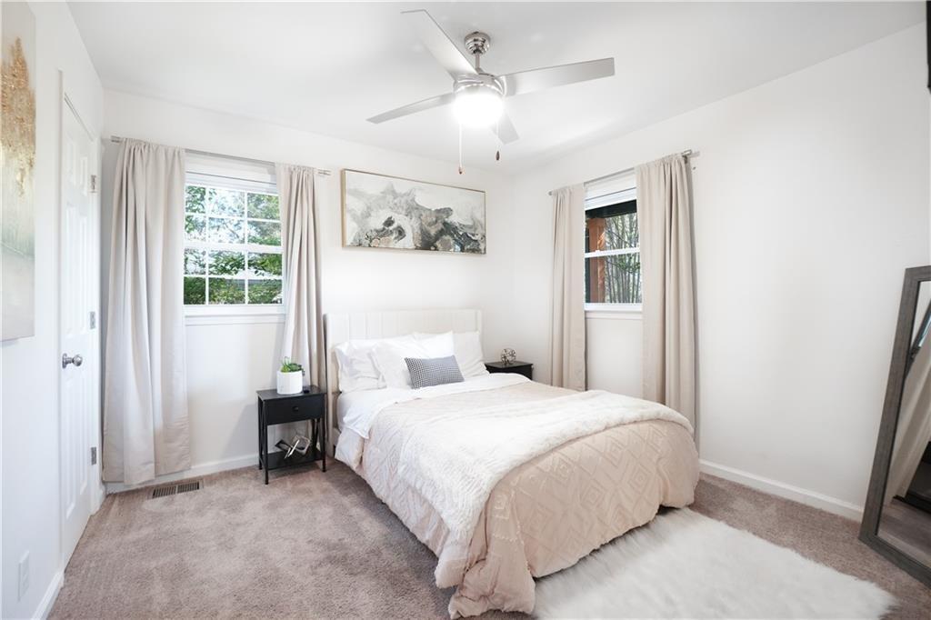 444 Fairburn Road Northwest Atlanta, GA 30331 - Photo 14 of 21 a bedroom with a bed and a window