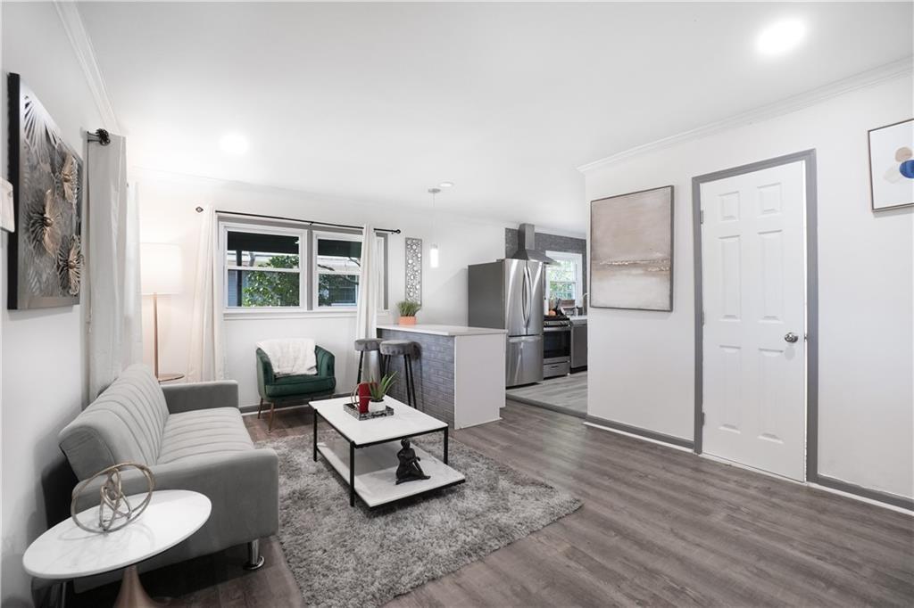 444 Fairburn Road Northwest Atlanta, GA 30331 - Photo 3 of 21 a living room with furniture and a flat screen tv