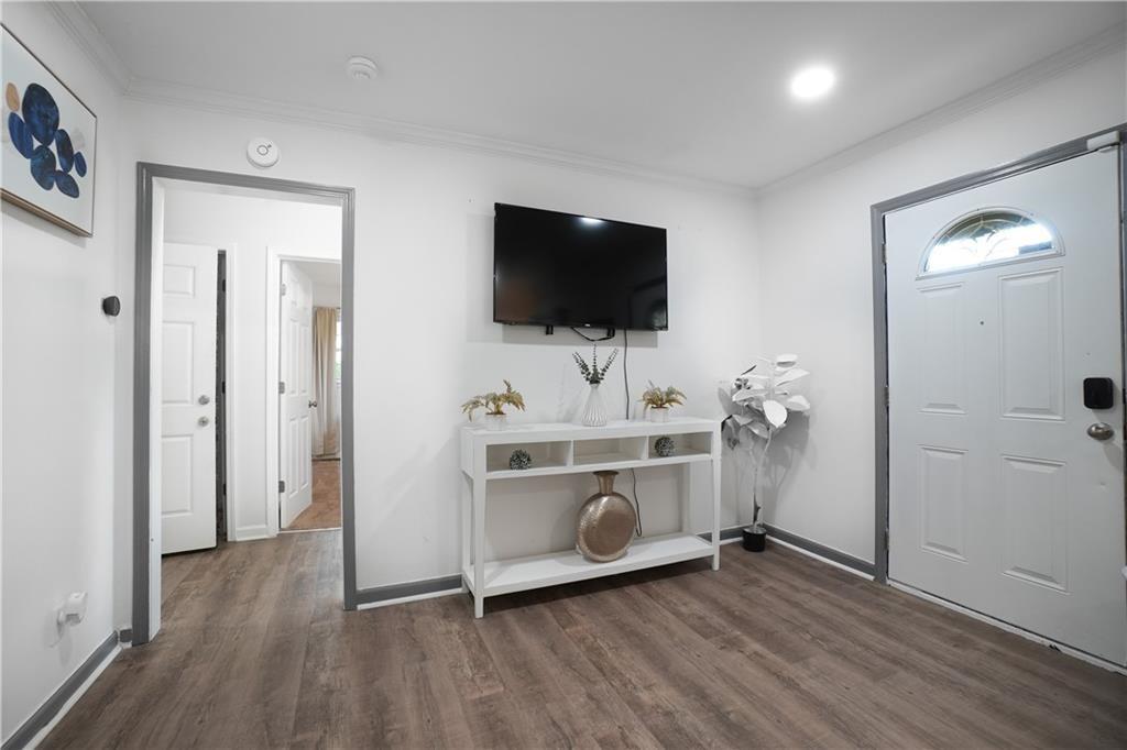 444 Fairburn Road Northwest Atlanta, GA 30331 - Photo 7 of 21 a view of a livingroom with a hardwood and a flat screen tv