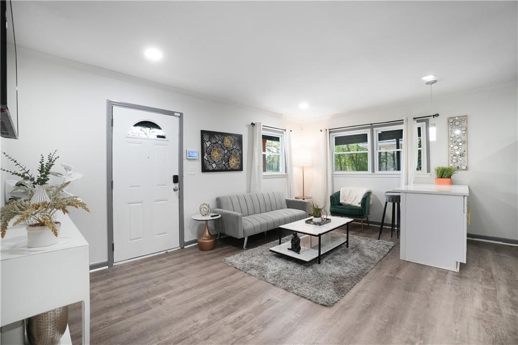 444 Fairburn Road Northwest Atlanta, GA 30331 - Photo 8 of 21 a living room with furniture and wooden floor