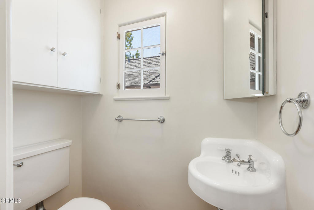 369 West Kenneth Road Glendale, CA 91202 - Photo 31 of 36 a bathroom with a sink and a toilet