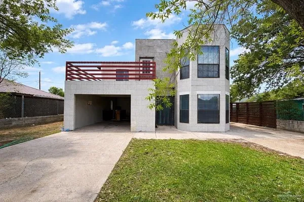 a front view of a house with yard and outdoor space