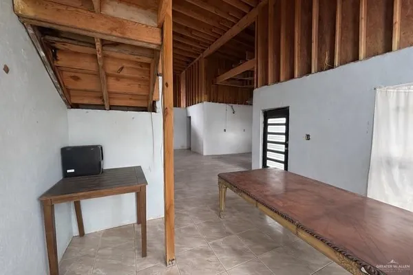 a view of an empty room with windows
